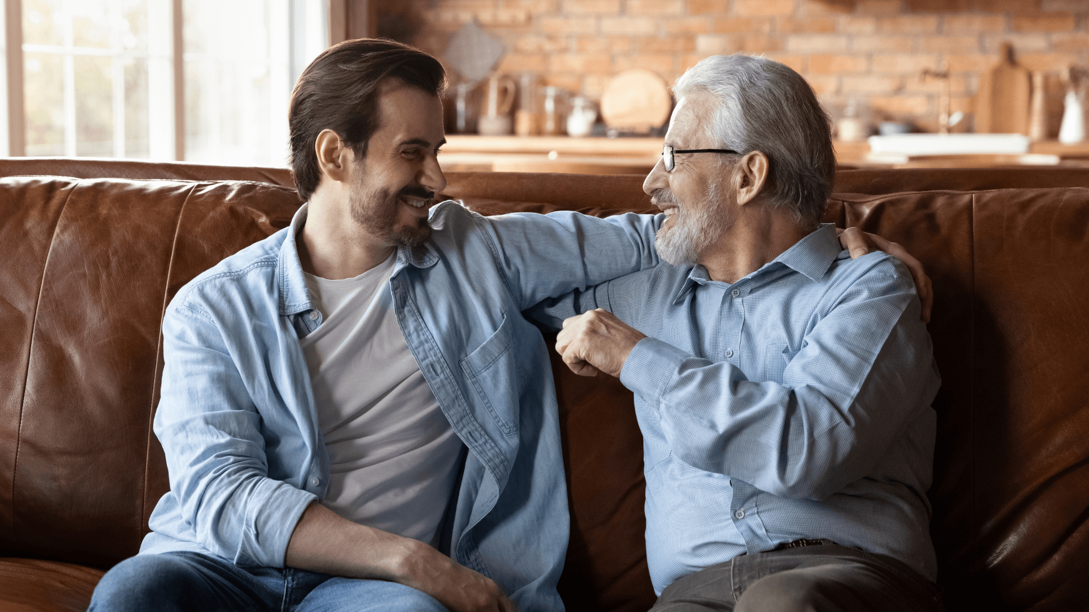 Father and son discussing the sale and succession of their family business during exit planning