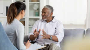 Business owner discussing next steps with an advisor after signing a letter of intent to sell
